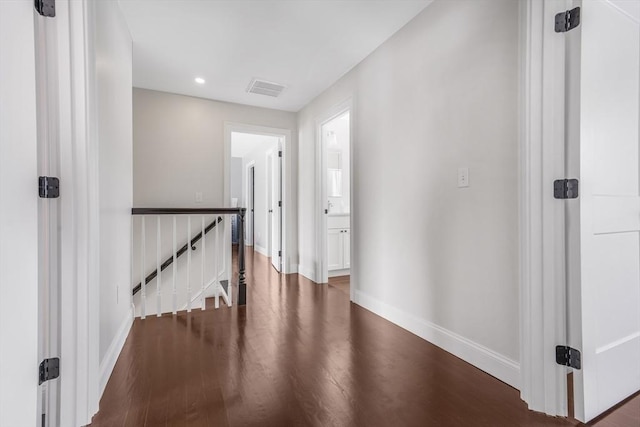 corridor with wood-type flooring