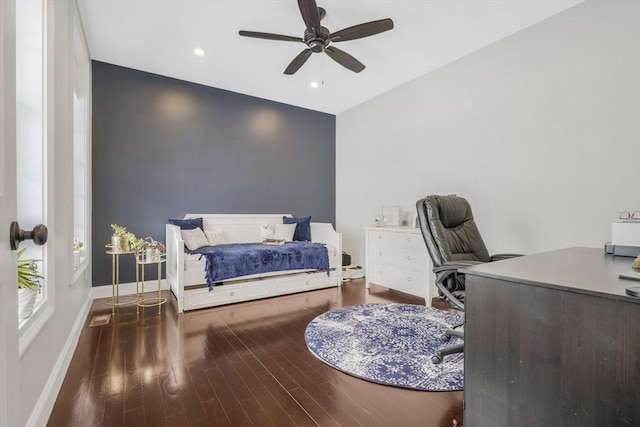 bedroom with ceiling fan and hardwood / wood-style flooring