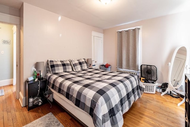 bedroom with light hardwood / wood-style floors