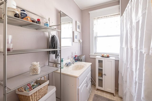 bathroom featuring vanity and toilet