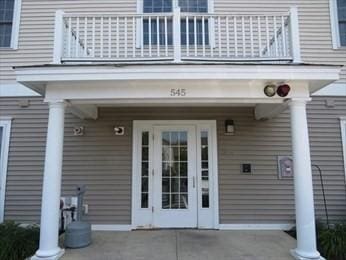 doorway to property featuring a balcony