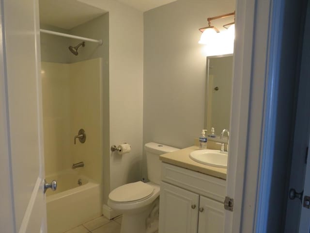 full bath featuring vanity, tile patterned floors, toilet, and shower / bathtub combination