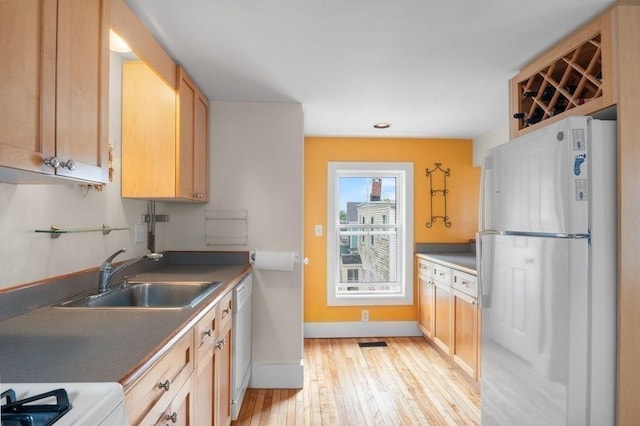 30 Oakland St Unit 2, Newburyport, MA 01950 - kitchen featuring freestanding refrigerator, dishwasher, light wood-style floors, light brown cabinetry, and recessed lighting