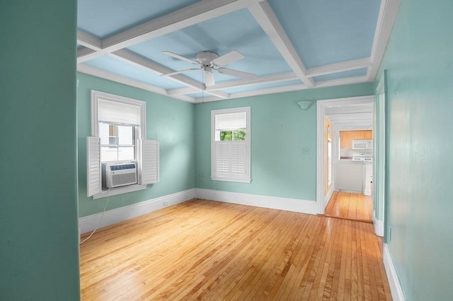 30 Oakland St Unit 2, Newburyport, MA 01950 - empty room with coffered ceiling, hardwood / wood-style flooring, beam ceiling, a ceiling fan, and cooling unit