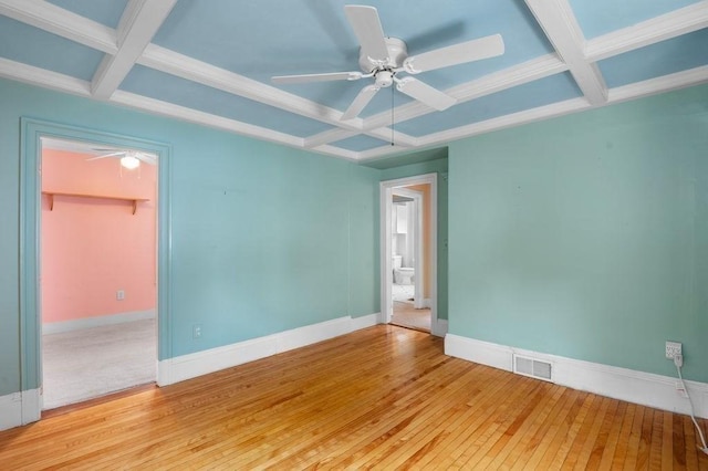 30 Oakland St Unit 2, Newburyport, MA 01950 - spare room featuring coffered ceiling, ceiling fan, wood-type flooring, and beam ceiling