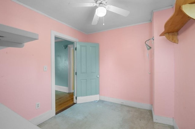 30 Oakland St Unit 2, Newburyport, MA 01950 - empty room featuring carpet flooring, ornamental molding, and a ceiling fan