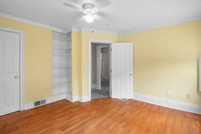 30 Oakland St Unit 2, Newburyport, MA 01950 - unfurnished bedroom with light wood-type flooring, crown molding, and a ceiling fan