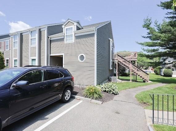 14 Shaw Farm Rd Unit 14, Canton, MA 02021 - view of side of home featuring stairway and uncovered parking