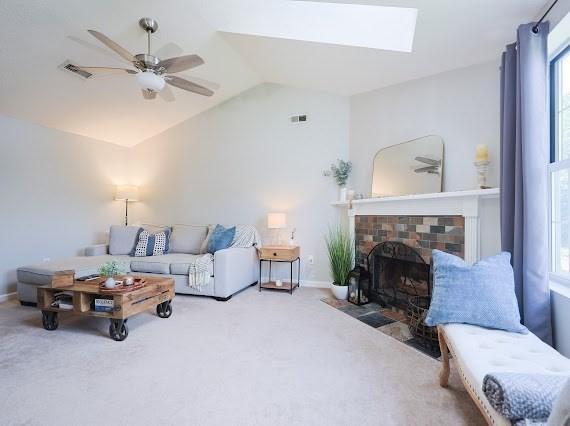 14 Shaw Farm Rd Unit 14, Canton, MA 02021 - living area with lofted ceiling, carpet, plenty of natural light, and a ceiling fan