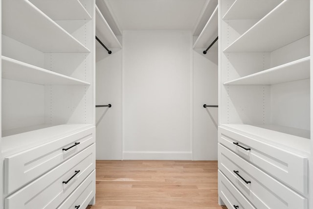 walk in closet featuring light hardwood / wood-style floors