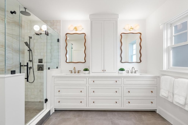 bathroom with tile patterned flooring, vanity, and an enclosed shower