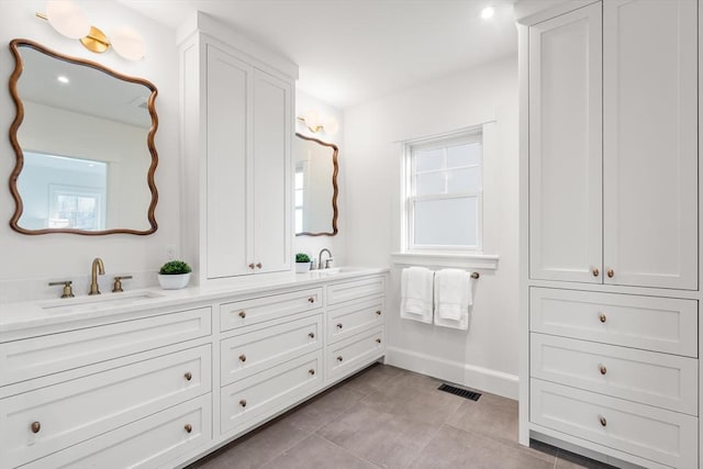 bathroom featuring tile patterned floors and vanity