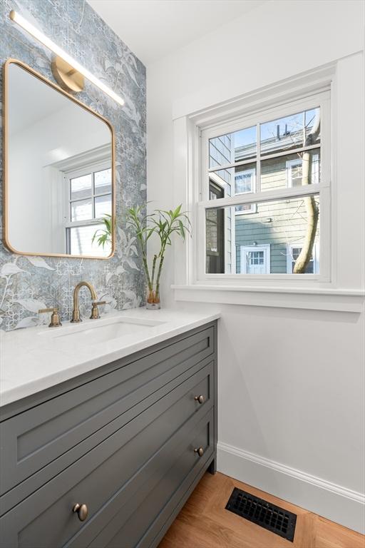 bathroom featuring hardwood / wood-style floors and vanity