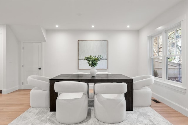 dining space featuring wood-type flooring