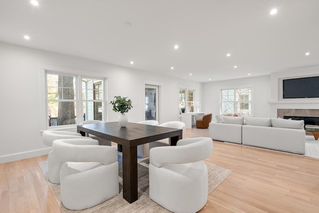 dining space with light wood-type flooring