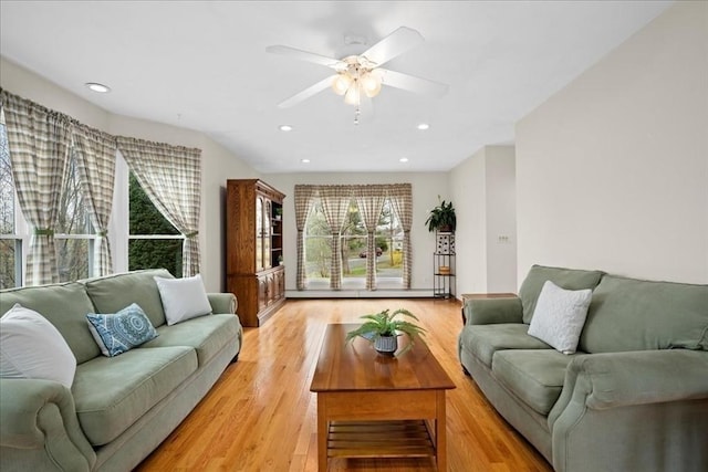 living area featuring recessed lighting, ceiling fan, and light wood-type flooring