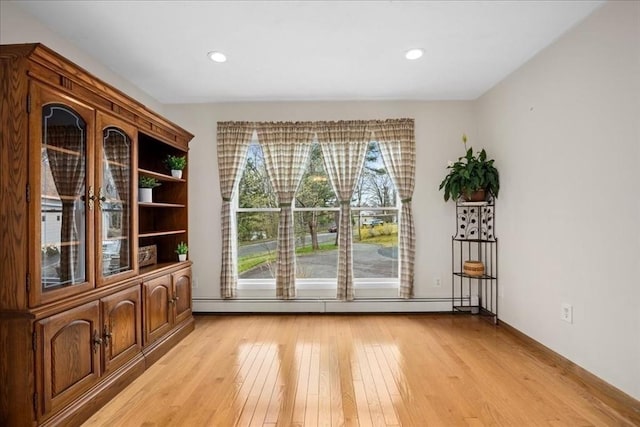 entryway with recessed lighting, light wood finished floors, and baseboard heating