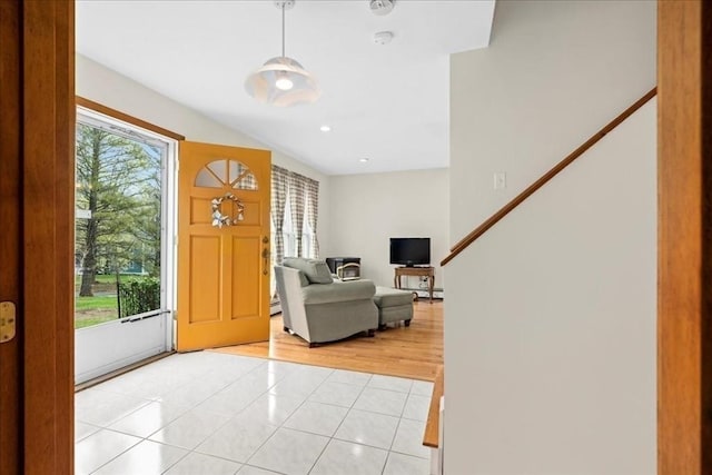 foyer with recessed lighting and light tile patterned flooring