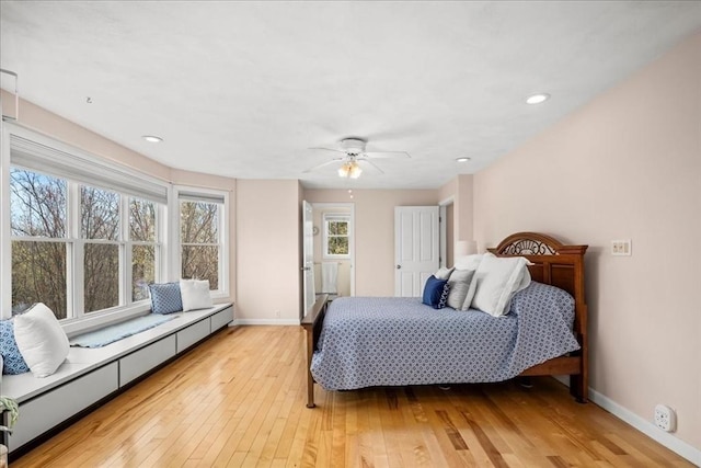 bedroom featuring recessed lighting, baseboards, a baseboard radiator, and light wood-type flooring