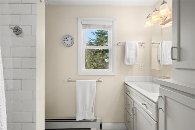 bathroom featuring vanity, baseboards, a shower with shower curtain, and a baseboard heating unit