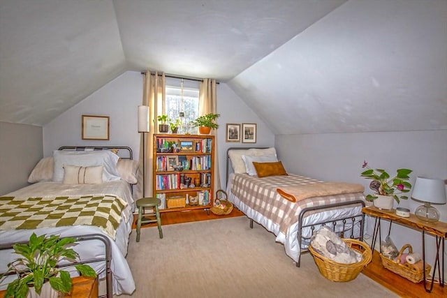 bedroom with lofted ceiling