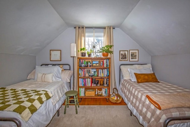 bedroom featuring hardwood / wood-style flooring and lofted ceiling