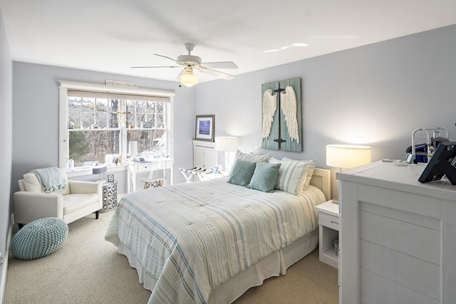 bedroom with light colored carpet and ceiling fan