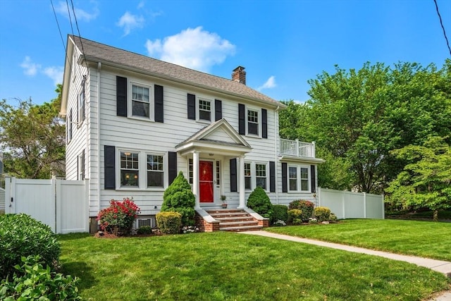 43 Chilton St, Belmont, MA 02478 - colonial-style house with a balcony and a chimney