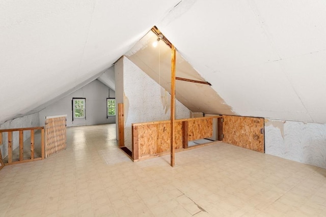 43 Chilton St, Belmont, MA 02478 - bonus room featuring tile patterned floors, vaulted ceiling, and wallpapered walls