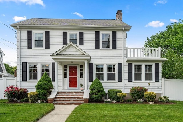 43 Chilton St, Belmont, MA 02478 - colonial-style house with a balcony and a chimney