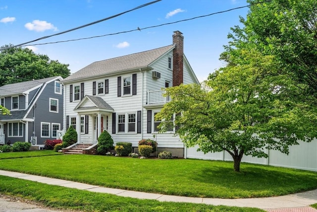 43 Chilton St, Belmont, MA 02478 - colonial house featuring a chimney and a front yard