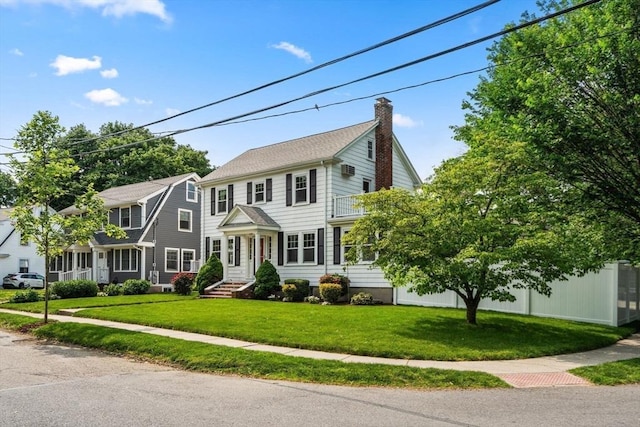 43 Chilton St, Belmont, MA 02478 - colonial-style house featuring a chimney and a front lawn