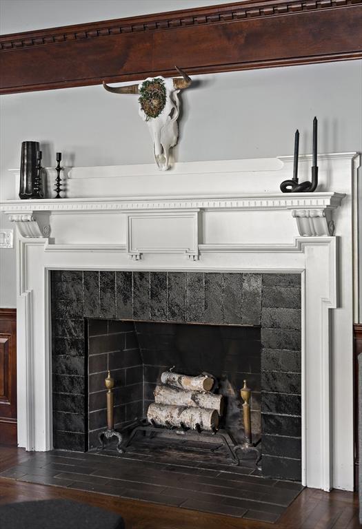 9 Prospect St, Winchester, MA 01890 - detailed view of a tiled fireplace and wood finished floors