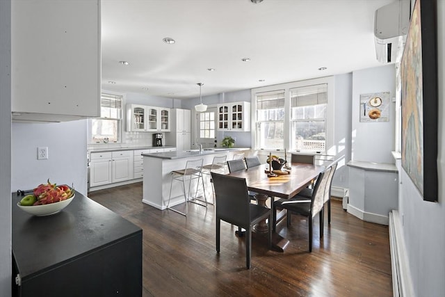 9 Prospect St, Winchester, MA 01890 - dining space featuring dark wood-style flooring, a baseboard radiator, recessed lighting, a wall mounted air conditioner, and baseboards