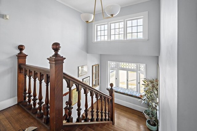 9 Prospect St, Winchester, MA 01890 - stairs with baseboards, a chandelier, crown molding, and wood finished floors
