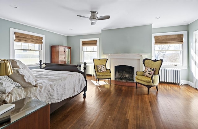 9 Prospect St, Winchester, MA 01890 - bedroom featuring radiator, a fireplace, wood finished floors, and crown molding