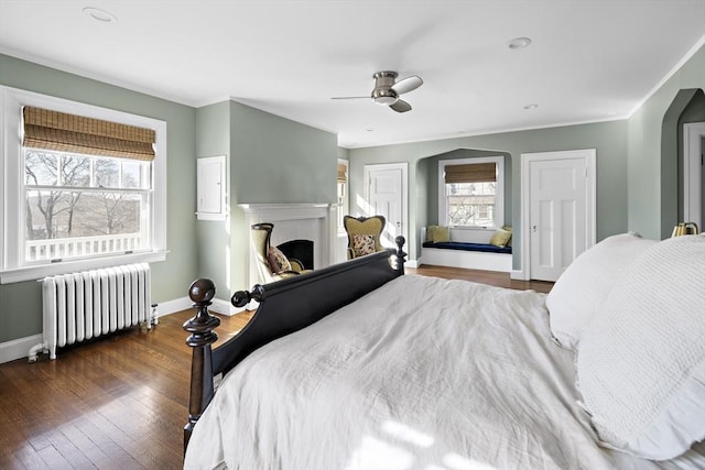 9 Prospect St, Winchester, MA 01890 - bedroom with radiator heating unit, baseboards, wood finished floors, ceiling fan, and ornamental molding