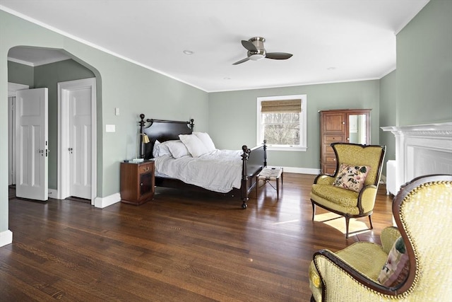 9 Prospect St, Winchester, MA 01890 - bedroom featuring arched walkways, crown molding, baseboards, wood finished floors, and a ceiling fan