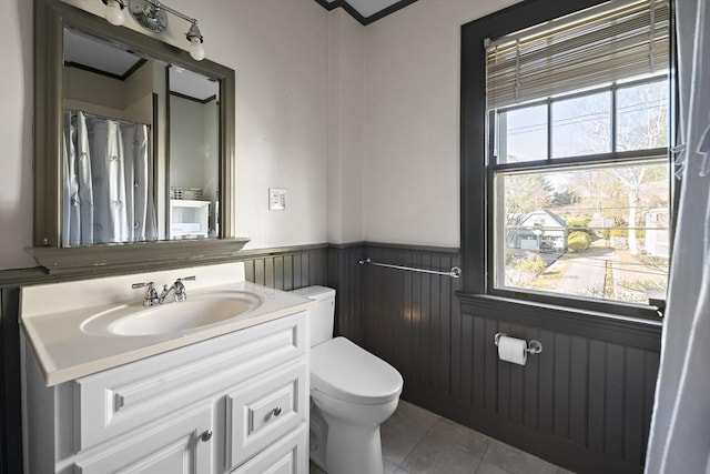 9 Prospect St, Winchester, MA 01890 - full bathroom with wainscoting, toilet, tile patterned flooring, and vanity