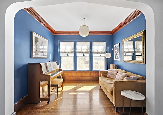 9 Prospect St, Winchester, MA 01890 - sitting room featuring wood finished floors, ornamental molding, and arched walkways