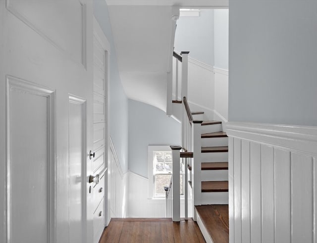 9 Prospect St, Winchester, MA 01890 - staircase featuring a wainscoted wall and wood finished floors