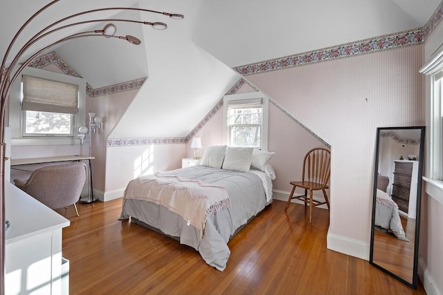 9 Prospect St, Winchester, MA 01890 - bedroom with vaulted ceiling, wood finished floors, and baseboards