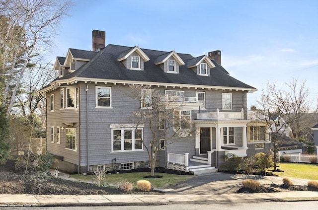 9 Prospect St, Winchester, MA 01890 - view of front facade featuring a balcony and a chimney