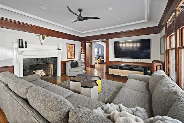 9 Prospect St, Winchester, MA 01890 - living area featuring wood finished floors, arched walkways, ceiling fan, ornamental molding, and a fireplace