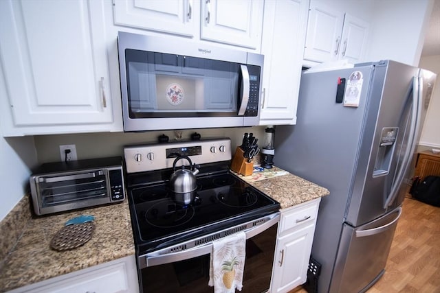 1610 Franklin Crossing Rd Unit 1610, Franklin, MA 02038 - kitchen featuring appliances with stainless steel finishes and white cabinets