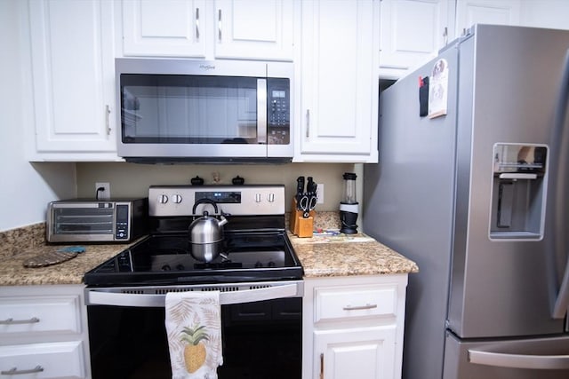 1610 Franklin Crossing Rd Unit 1610, Franklin, MA 02038 - kitchen featuring stainless steel appliances, white cabinetry, and light stone countertops