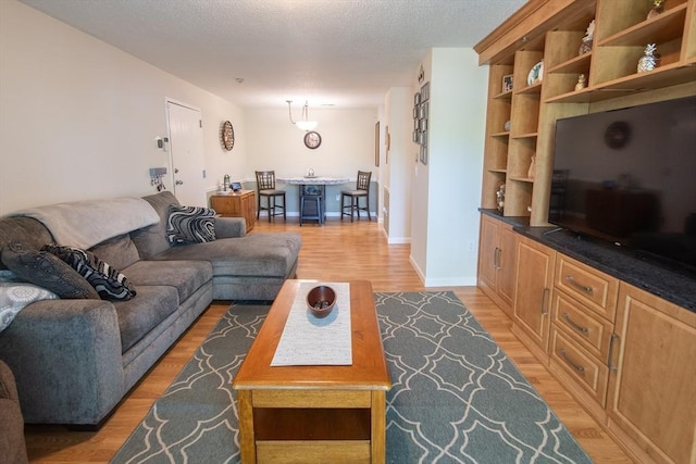 1610 Franklin Crossing Rd Unit 1610, Franklin, MA 02038 - living area featuring light wood-style flooring and baseboards