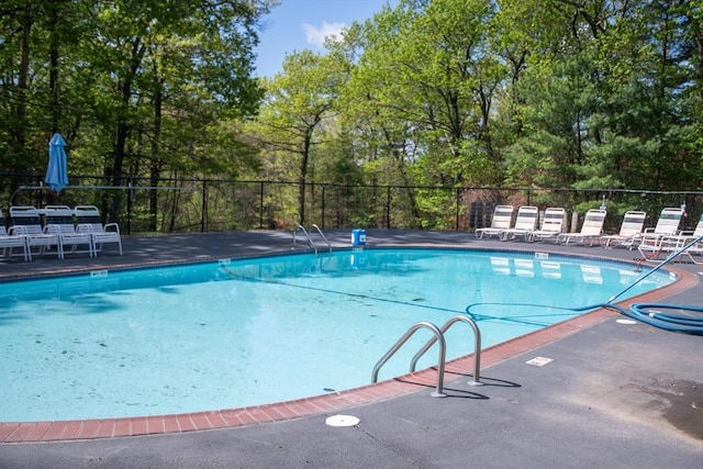 1610 Franklin Crossing Rd Unit 1610, Franklin, MA 02038 - community pool with view of scattered trees and a patio area