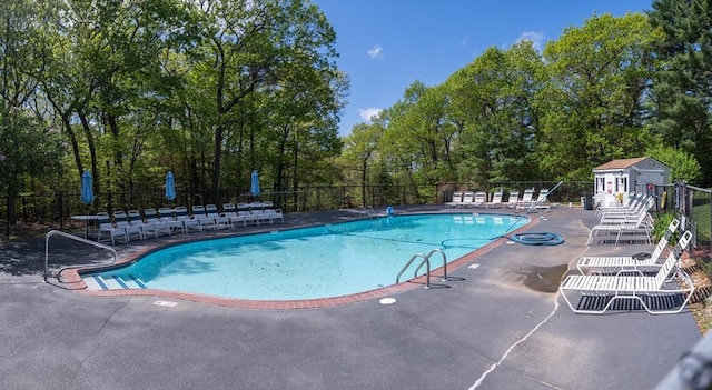 1610 Franklin Crossing Rd Unit 1610, Franklin, MA 02038 - community pool featuring a patio and view of wooded area