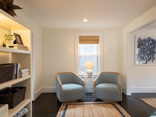 sitting room with crown molding, recessed lighting, baseboards, and dark wood-type flooring